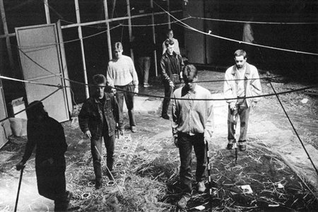 A black and white picture of the first Dark event in Frankfurt. Visitors explore a parcour that was set up with ropes leading through the dark.