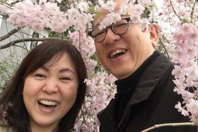 Portrait of Shinsuke and Kiyoe standing in the middle of cherry blossoms.