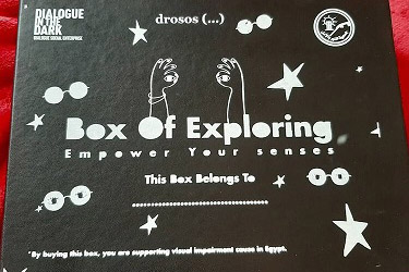 Photo of the packaging of the Box of Exploring in black with white print.